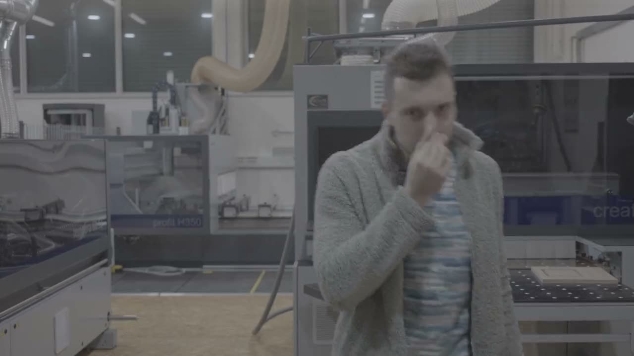 A rejected take: the instructor's hand rises to his chin mid-sentence, stuck, then he looks at the camera and walks away.